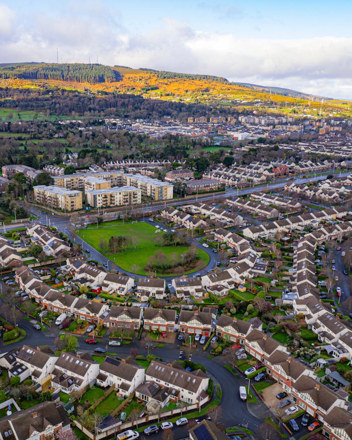 Discover the picturesque aerial view of Leopardstown in Dublin, showcasing vibrant suburban landscapes and rolling hills.